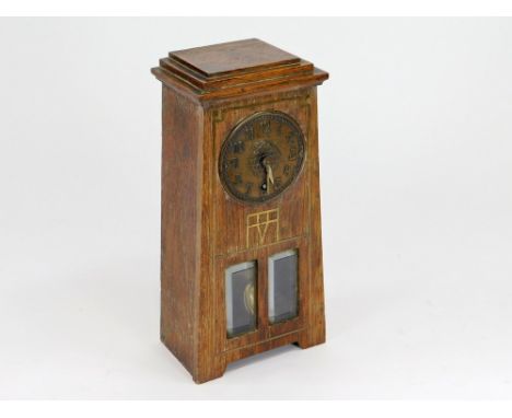 ARTS & CRAFTS CLOCK. An Arts & Crafts brass inlaid mantel clock with copper dial & pendulum movement. (No key). Height 24.5cm