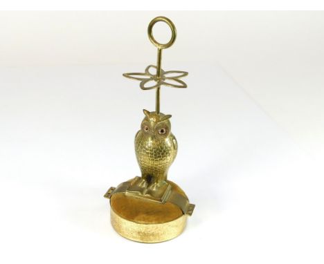 HAT PIN STAND. A brass owl hat pin stand. Height 18.5cm.  Please note that all items in this auction are previously owned & a