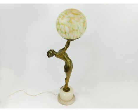 TABLE LAMP. An Art Deco, gilt metal, figural table lamp with marbled glass shade. Height 60cm.  Please note that all items in