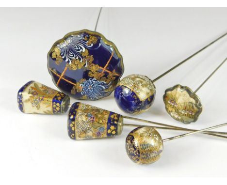 SATSUMA HAT PINS. Two tapering Japanese Satsuma hat pins decorated with flowers between blue & gilt borders. Also, a large fl
