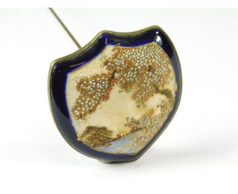 SATSUMA HAT PIN. A large Japanese Satsuma hat pin. To the reverse an impressed mons. Length 23cm, max. width 4.5cm.  All hatp