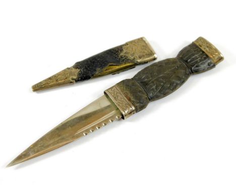 SKEAN DHU. A silver mounted Scottish skean dhu with Cairngorm pommel, damaged sheath. Length 19.5cm.  Please note that all it