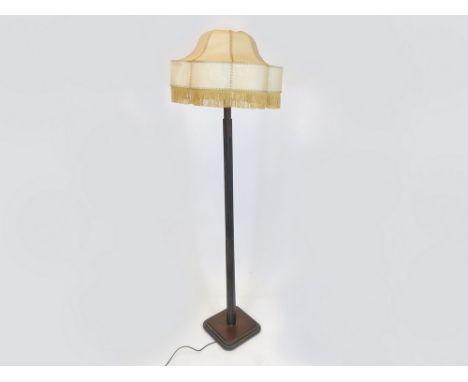 ART DECO STANDARD LAMP. An Art Deco, dark oak & ebonised standard lamp with architectural fluting. Original fringed celluloid