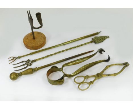 FIRE IRONS ETC. A pair of Arts & Crafts hammered brass fire tongs, other fire irons, a telescopic toasting fork & a rushlight