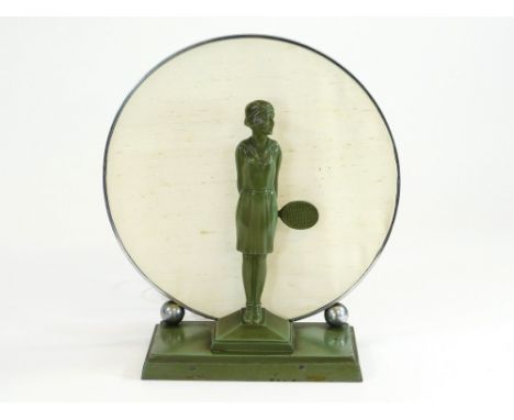 ART DECO LAMP. An Art Deco, green painted metal tennis player table lamp. Bakelite lamp holder behind a chromium plated scree