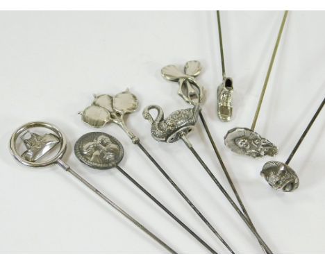 HAT PINS. Eight various silver & silver plated hat pins, including a double faced hat pin, a cat, a Japanese lady etc. Longes