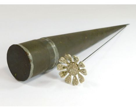 HAT PIN BOX. A sheet metal, tapering hat pin box, containing a large paste hat pin. Hat pin length 31m. Hat pin box 35cm.  Pl