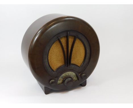 EKCO RADIO. An Ekco all electric radio. Type A.D.75. Bakelite case, fabric speaker grill & celluloid tuning dial. (Tuning dia