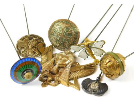 BRASS HAT PINS ETC. A large hinged Egyptian pharaoh hat pin, width 6cm & three other Egyptianesque hat pins. Also, two Art No