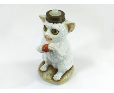 PORCELAIN TABLE LAMP. A continental porcelain cat table lamp with naturalistic inset glass eyes. Height 17cm.  Please note th