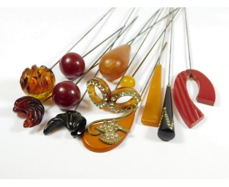 CELLULOID HAT PINS ETC. Eleven various celluloid hat pins & a horn hat pin. Longest 28cm.  All hatpins are in clean or reason