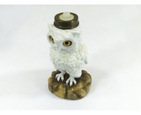 PORCELAIN TABLE LAMP. A continental porcelain owl table lamp with naturalistic inset glass eyes. Height 17cm.  Please note th