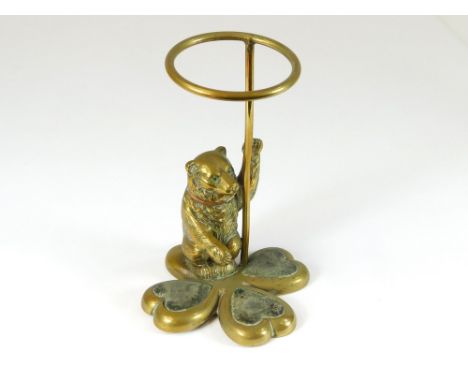 HAT PIN STAND. An antique brass bear hat pin stand. Height 14cm.  Please note that all items in this auction are previously o