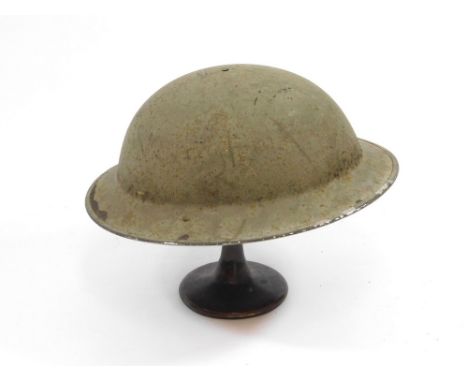 WWII HELMET. A WWI helmet. No strap. Width approx. 31cm. Condition: Slight surface loss to rim & light rust.  Please note tha