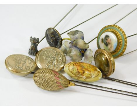 MISCELLANEOUS HAT PINS. A pair of hinged hat pins embossed with a horse drawn sleigh & backed with Norene Patent pin guards. 