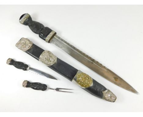 SCOTTISH DIRK. A 20th century Scottish dirk with carved bog oak grip, two silver plated St. Andrew & Saltire mounts & a mount