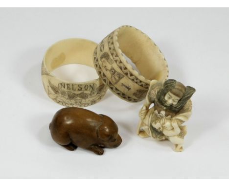 NETSUKE ETC. A small wooden dog netsuke & one other netsuke, signed. Also, two 'scrimshaw' napkin rings.  Please note that al