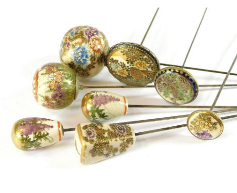 SATSUMA HAT PINS. A pair of Japanese Satsuma, wisteria decorated domed hat pins & a floral tapering hat pin. Also, three flat