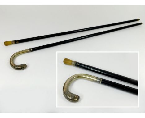 WALKING STICKS. An ebonised walking stick, with Alpacca silver plated hammered handle & an ebonised walking cane with horn ha