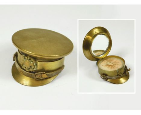 WWI CAP MINIATURE COMPACT. A miniature WWI brass officer's cap powder compact.  Please note that all items in this auction ar