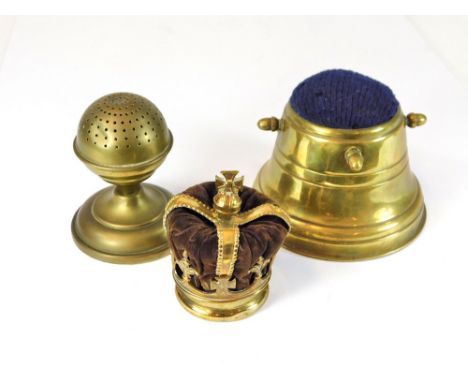 HAT PIN STANDS. A domed brass hat pin stand by Harris & Sheldon, a brass Capstan hat pin stand & a brass crown.  Please note 