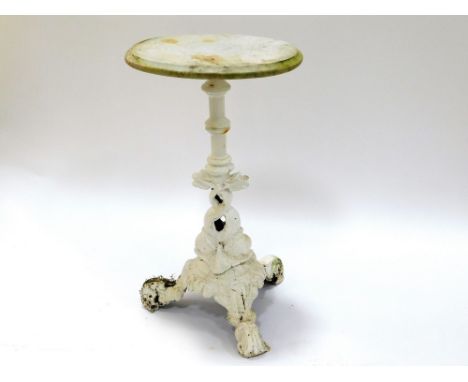 CAST IRON PEDESTAL TABLE. A cast iron pedestal table with tripod base, painted white, with oval marble top. Height 76cm. Top 