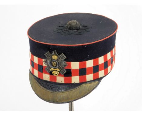 HIGHLAND INFANTRY FORAGE CAP. A Victorian officer's forage cap with badge of the Highland Light Infantry; by Cater & Company.