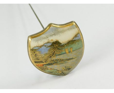 SATSUMA HAT PIN. A large Japanese hand Satsuma hat pin. Stamped mons to the reverse. Length of hat pin 29cm. Max. width 4cm. 
