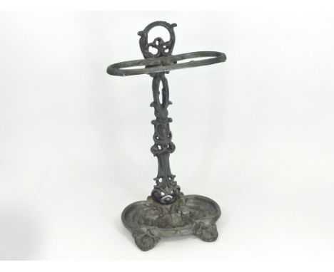 STICK STAND. A Victorian cast iron stick stand. Height 55cm.  Please note that all items in this auction are previously owned