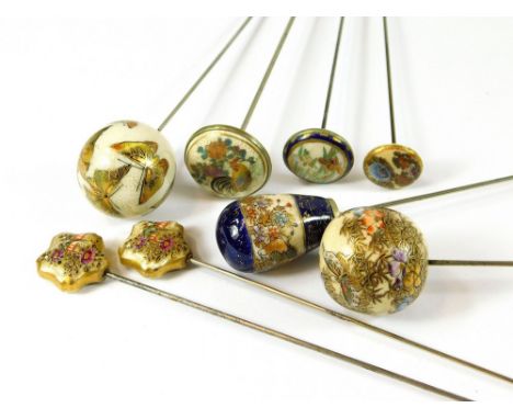 SATSUMA HAT PINS. Eight Japanese Satsuma hat pins, including a shaped pair & three flat topped hat pins, two stamped. Also, a
