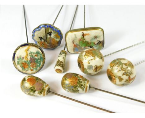 SATSUMA HAT PINS. Three flat top Japanese Satsuma hat pins, all stamped. Also, three tapering hat pins, including a domed pai