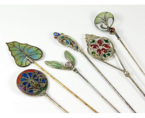 PLIQUE A JOUR ENAMEL ETC. Six plique a jour enamel hat pins, including French & German pins. Longest 25cm.  All hatpins are i