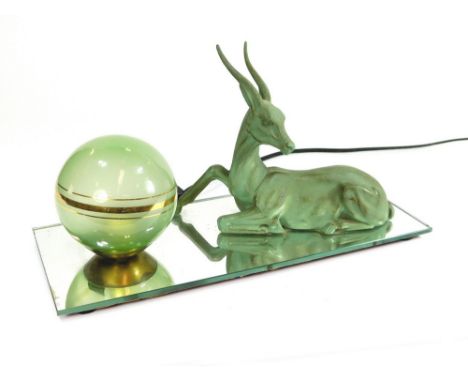 ART DECO LAMP. An Art Deco, green painted metal Antelope & a green glass & gilt small shade, now fitted onto a mirrored glass