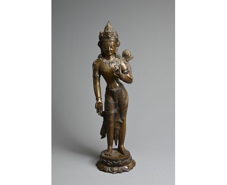 A FINE COPPER ALLOY FIGURE OF PADMAPANI, 18TH CENTURY. Heavily and finely cast figure standing on a lotus base holding a lotu