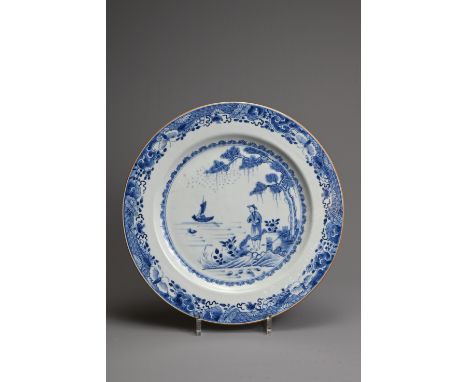 A LARGE CHINESE BLUE AND WHITE EXPORT PORCELAIN PLATE, 18TH CENTURY. Decorated with figure of a man lookout at a coastal scen