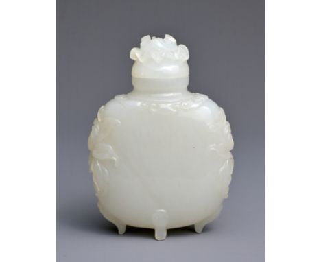 A CHINESE MUGHAL STYLE WHITE JADE SNUFF BOTTLE WITH COVER. Very finely hollowed and carved in relief set on  four ruyi feet w