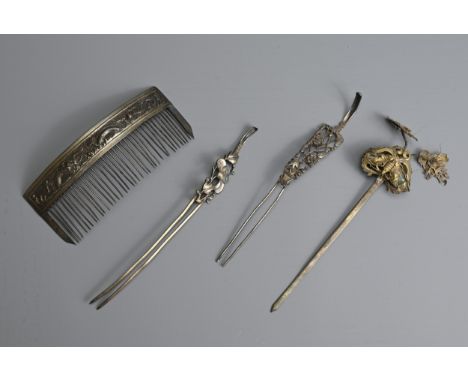 A GROUP OF CHINESE METAL WARE HAIR PINS, EARLY 20TH CENTURY. Two double pronged pins with pierced sections of floral scrolls 