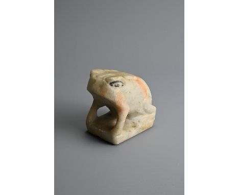 A CHINESE WHITE MABLE MODEL OF A FROG, TANG DYNASTY OR LATER. Seated on a rectangular base with black pigment forming the eye