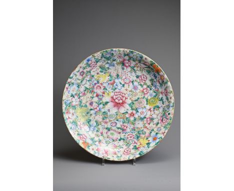 A LARGE CHINESE MILLEFLEUR DECORATED PORCELAIN DISH, EARLY 20TH CENTURY. Decorated with various flowers in famille rose ename