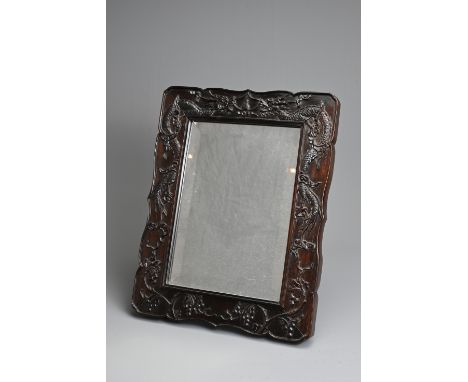 A CHINESE CARVED HARDWOOD FRAMED MIRROR, EARLY 20TH CENTURY. Decorated in relief with dragons and flowering branches. 35cm x 