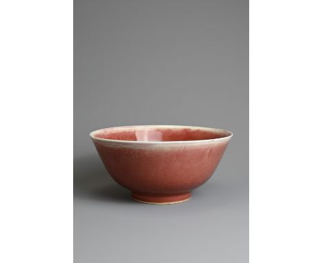 A CHINESE PEACH BLOOM GLAZED PORCELAIN BOWL, 18TH CENTURY. Rounded body with a gently everted rim raised on a short foot, cov