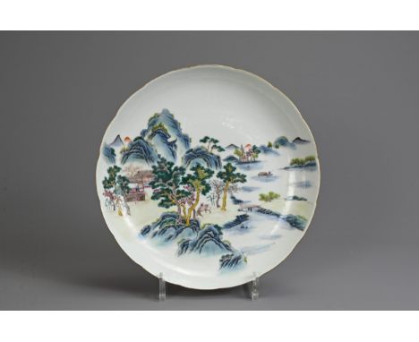 A CHINESE FAMILLE ROSE PORCELAIN DISH, EARLY 20TH CENTURY. Shallow dish with lobed sides and gilt rim, decorated with landsca