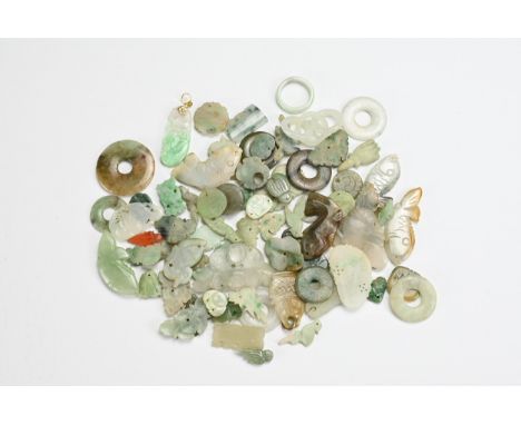 A QUANTITY OF JADE PENDANTS AND HAT FITTINGS, 19/20TH CENTURY. Of various colours and forms to include butterflies, fish, bir