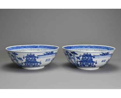 A LARGE PAIR OF CHINESE BLUE AND WHITE PORCELAIN BOWLS, LATE 19TH CENTURY. Each decorated with buildings in coastal scenes wi