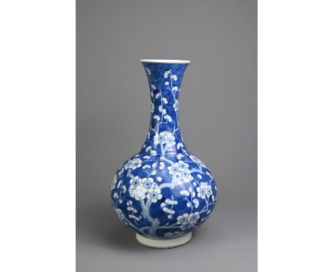 A CHINESE BLUE AND WHITE PORCELAIN PRUNUS BOTTLE VASE, 19TH CENTURY. With globular body and flared neck decorated with cherry