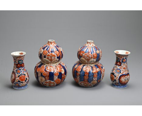 TWO PAIRS OF 19TH CENTURY JAPANESE IMARI VASES. The first of reeded double gourd-shape, moulded with ribbon-tied tassels and 