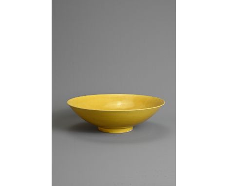 A RARE CHINESE YELLOW GLAZED PORCELAIN SHALLOW BOWL, MARK AND PERIOD OF JIAJING (1522-1566). Finely potted of conical form co