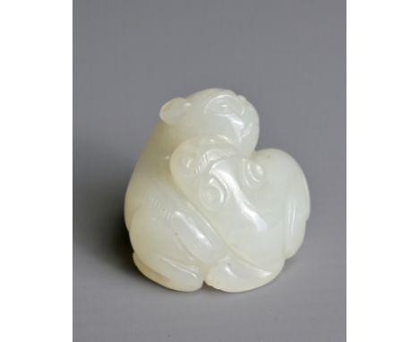 A CHINESE WHITE JADE LION GROUP PENDANT, QING DYNASTY. Carved in the form with two recumbent lions with their heads turned in