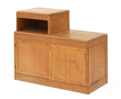 An oak bedside cabinet,with an offset shelf, over a cupboard, 76cm wide38cm deep63.5cm highCondition report: Knocks and cuffi