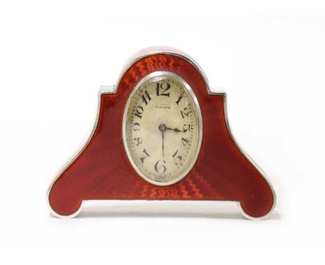 An Austrian silver and enamelled desk clock,the arched case centred with an elliptical dial with Arabic numerals, with an eng